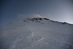 
Looking Up At The Steep Trail To The Traverse With Mount Elbrus East Summit Above At Sunrise
